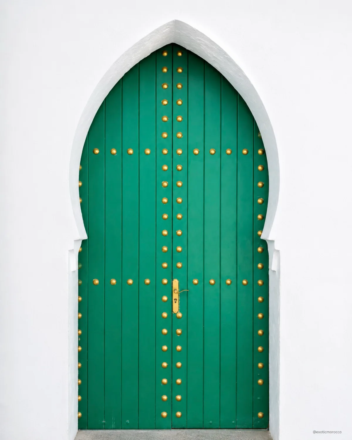 Green door and white wall in Asilah