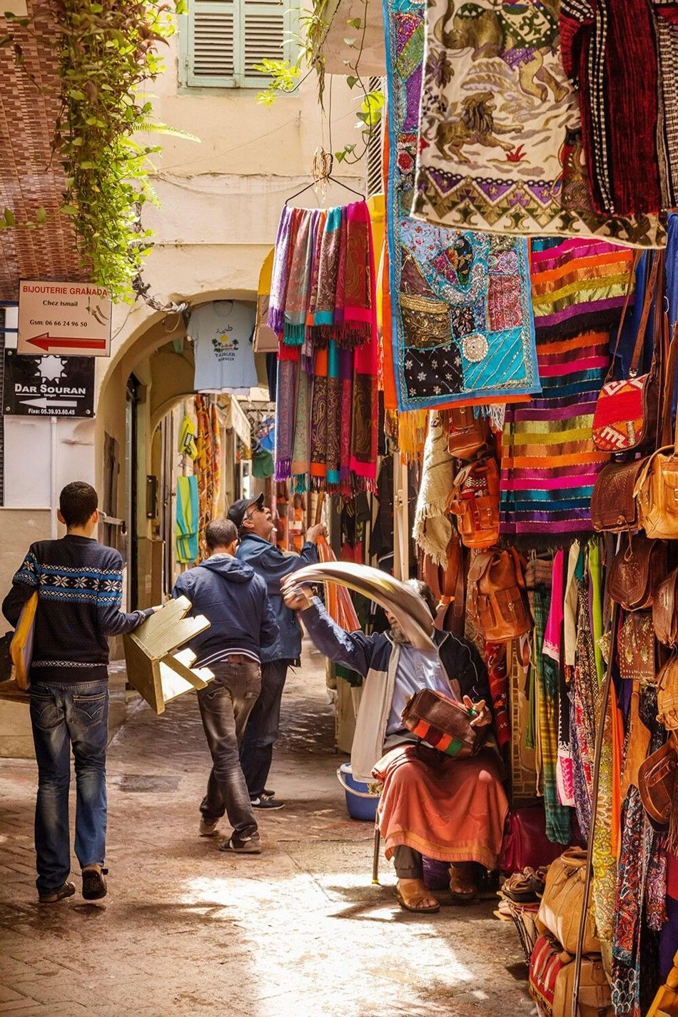 Medina alley with textiles and crafts