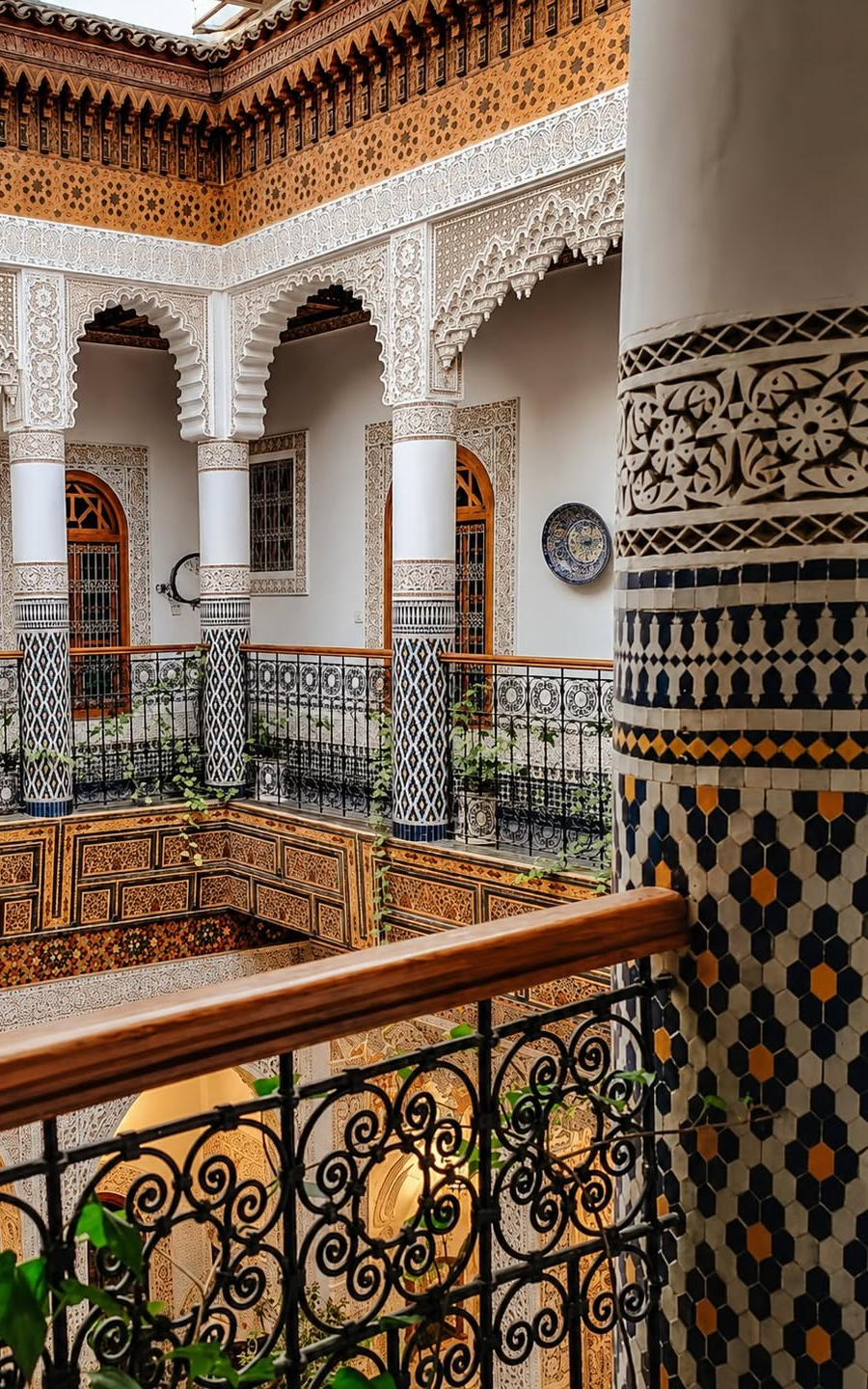 Moroccan architecture with carved arches and tile columns