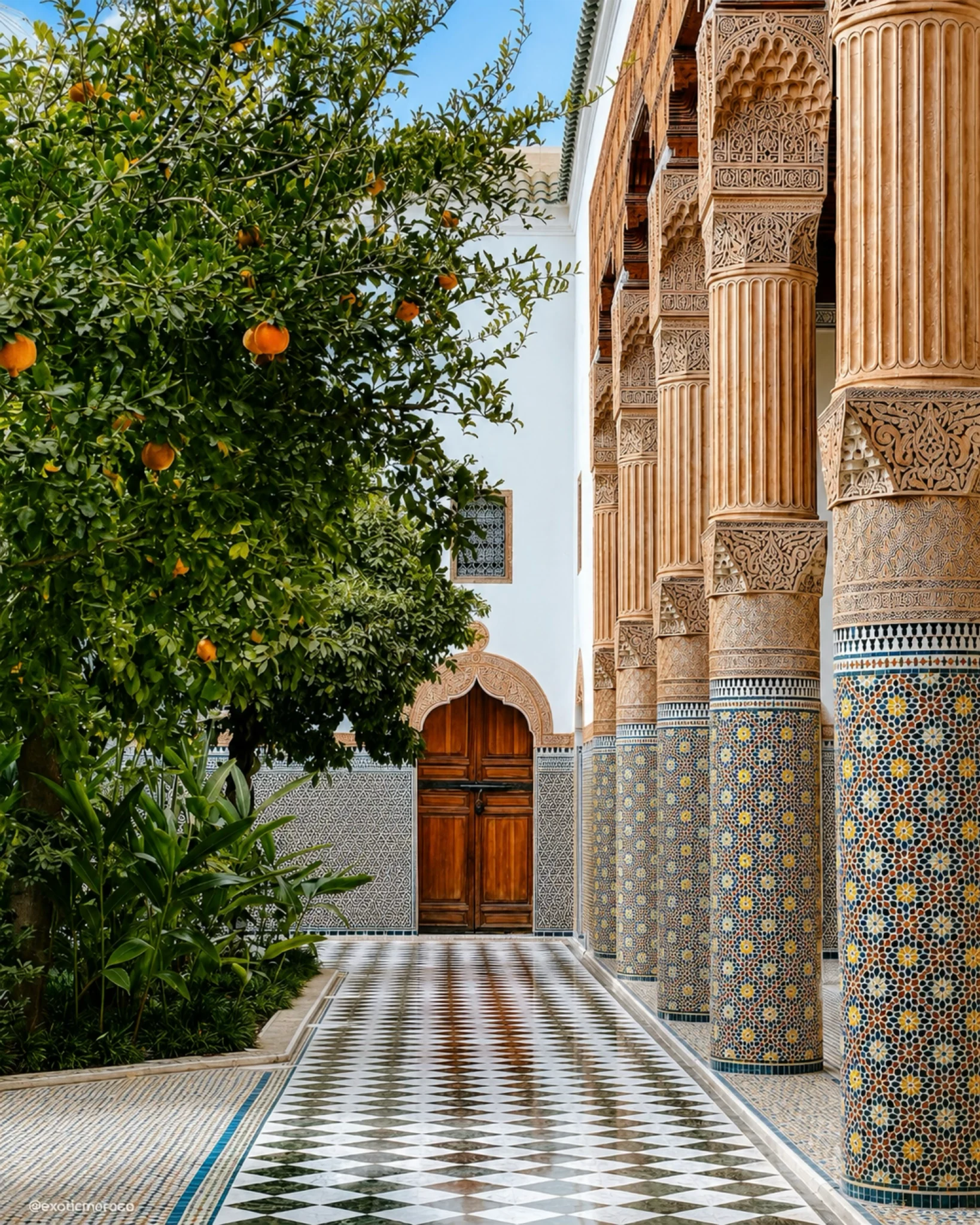 Premium Guides — elegant Moroccan courtyard with zellige columns, carved wood details and orange tree