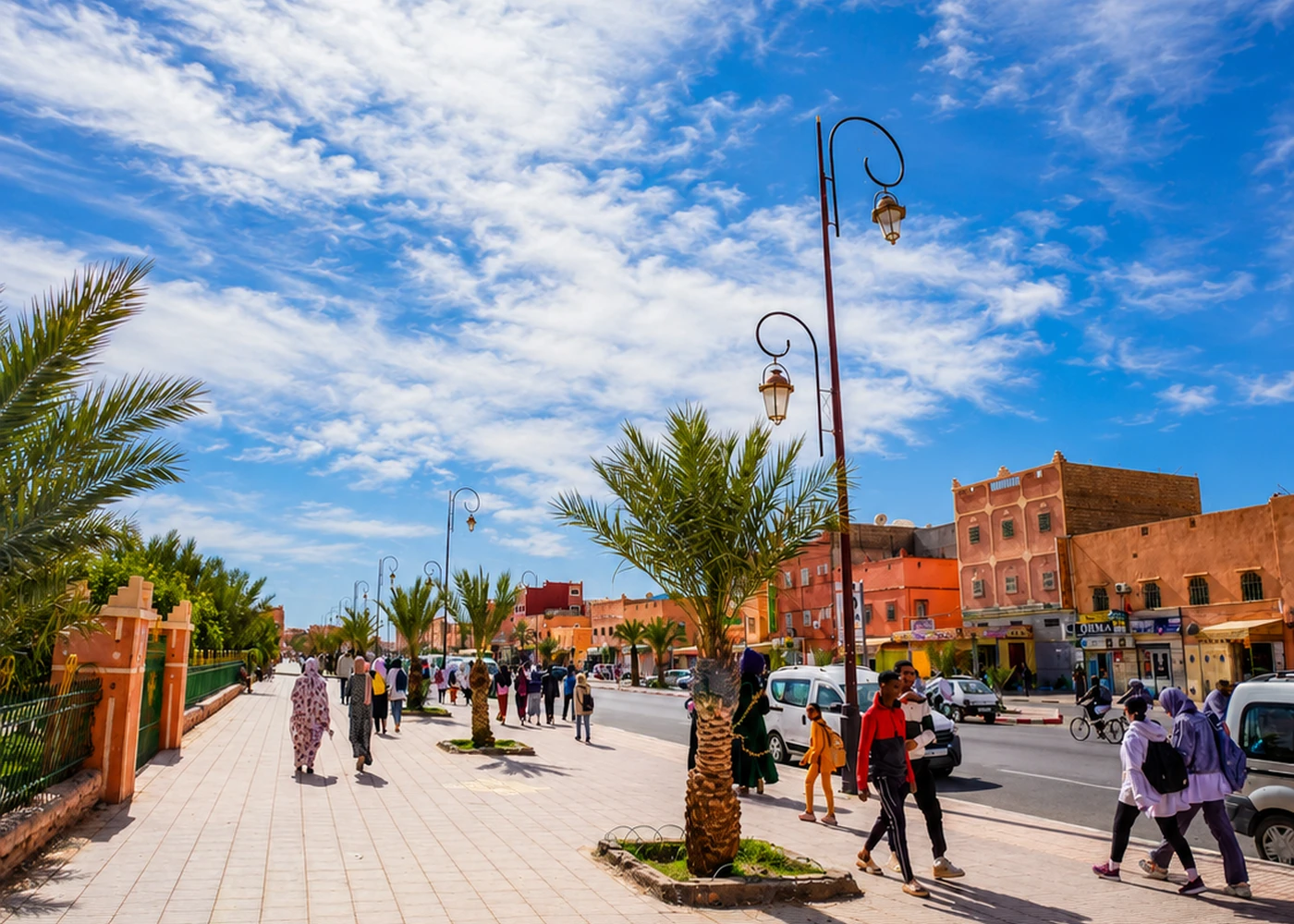A broad avenue with shops and pedestrians