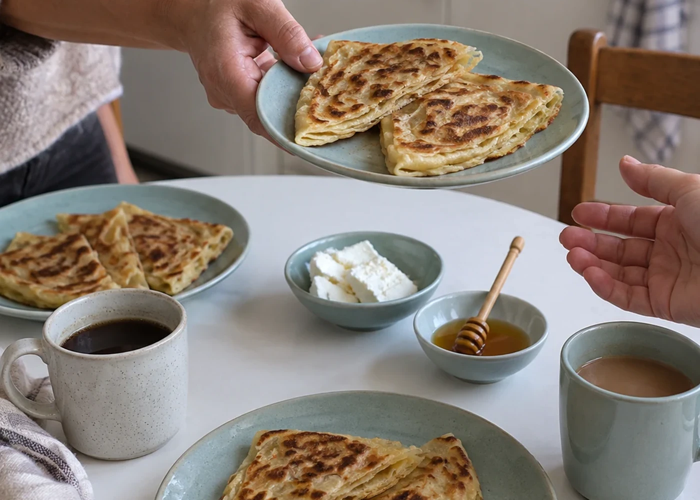 Bread offered at a breakfast table
