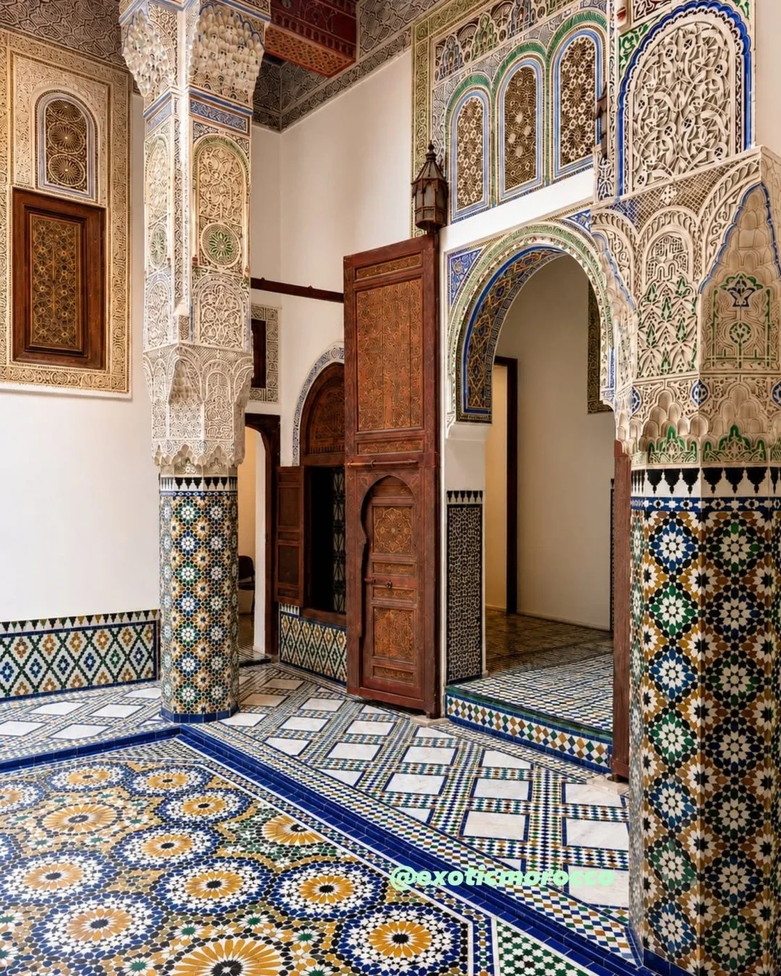 A decorated doorway with tile and plaster