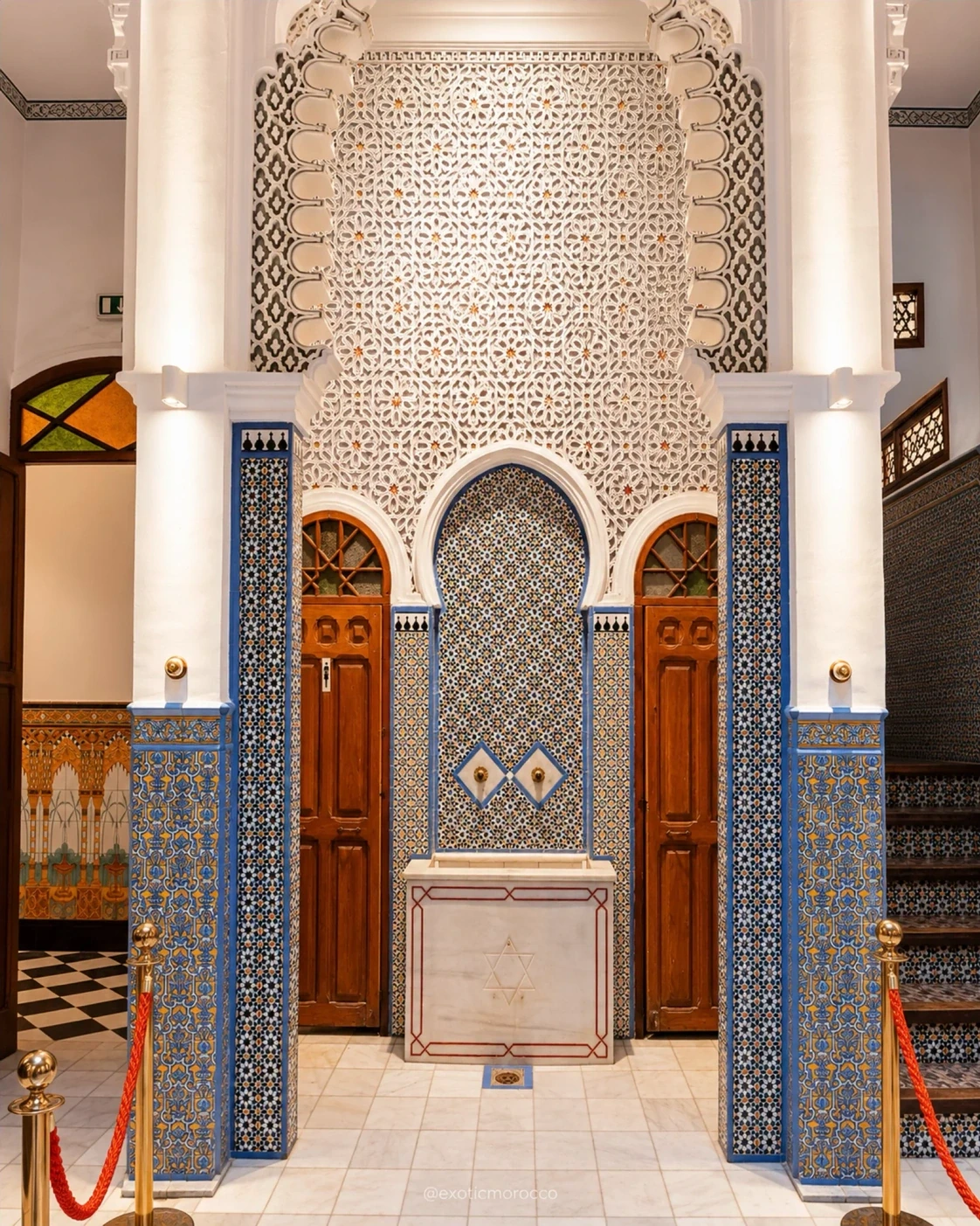 A decorated doorway with carved plaster