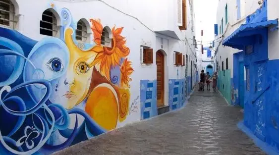 Blue Moroccan medina street with colorful mural