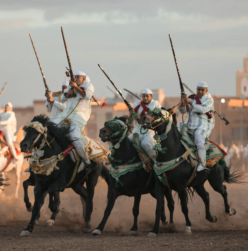 A team of riders moving together during tbourida