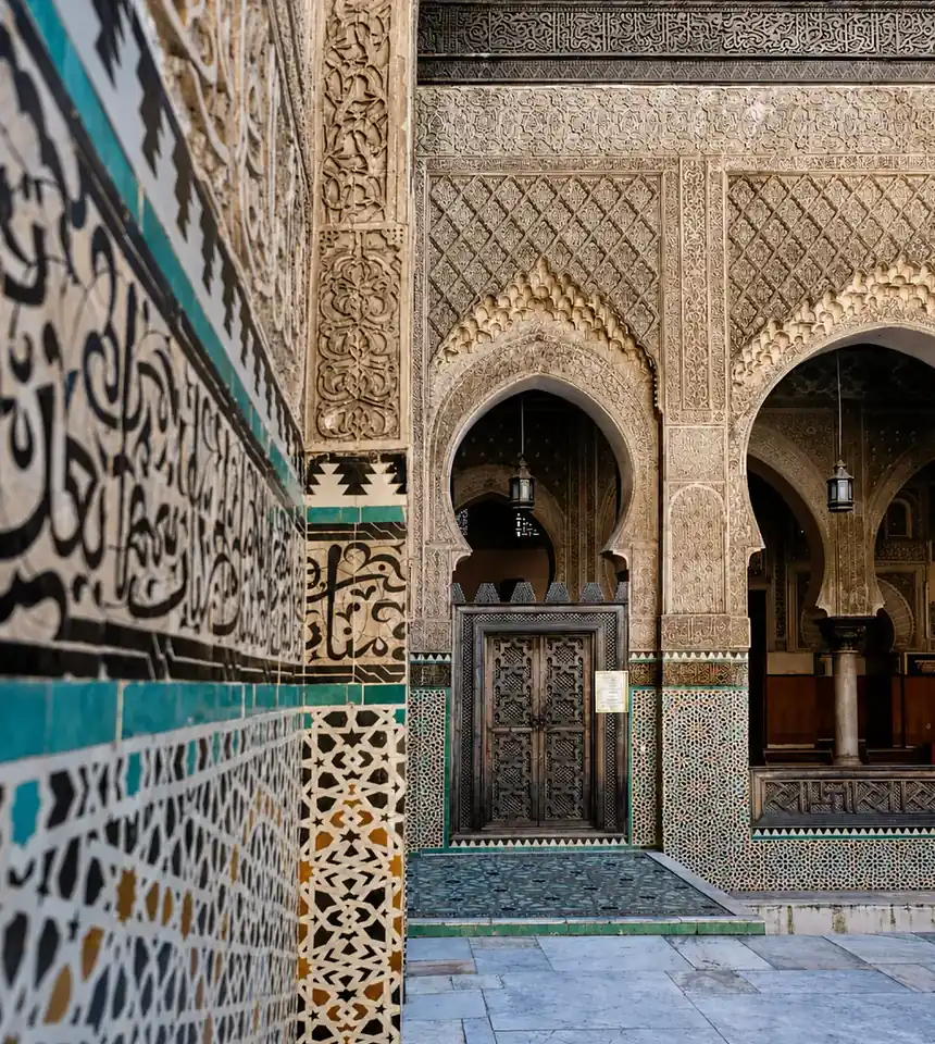 Carved stucco, calligraphy and zellij in Bou Inania Madrasa