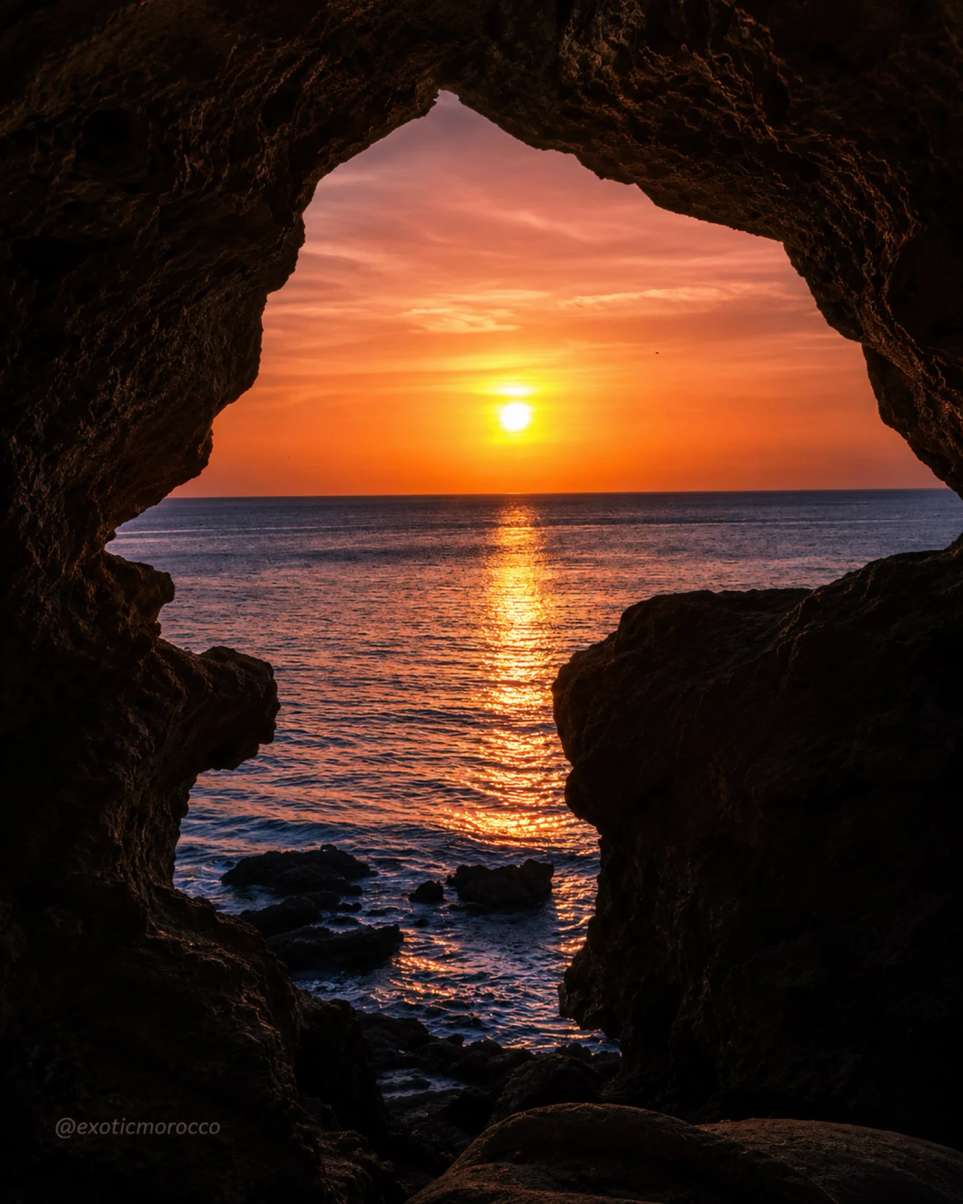 Caves of Hercules opening onto the Atlantic at sunset
