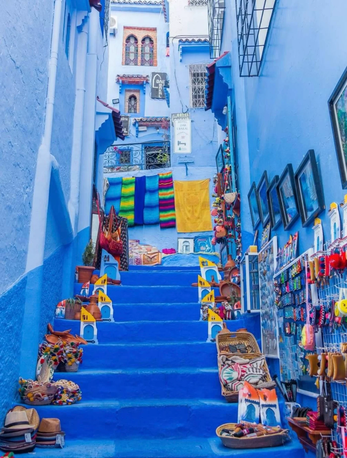 Blue-painted steps and craft displays in Chefchaouen