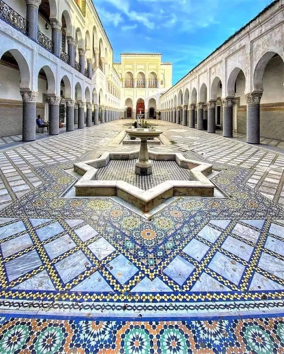 Large Moroccan courtyard with fountain and arcades