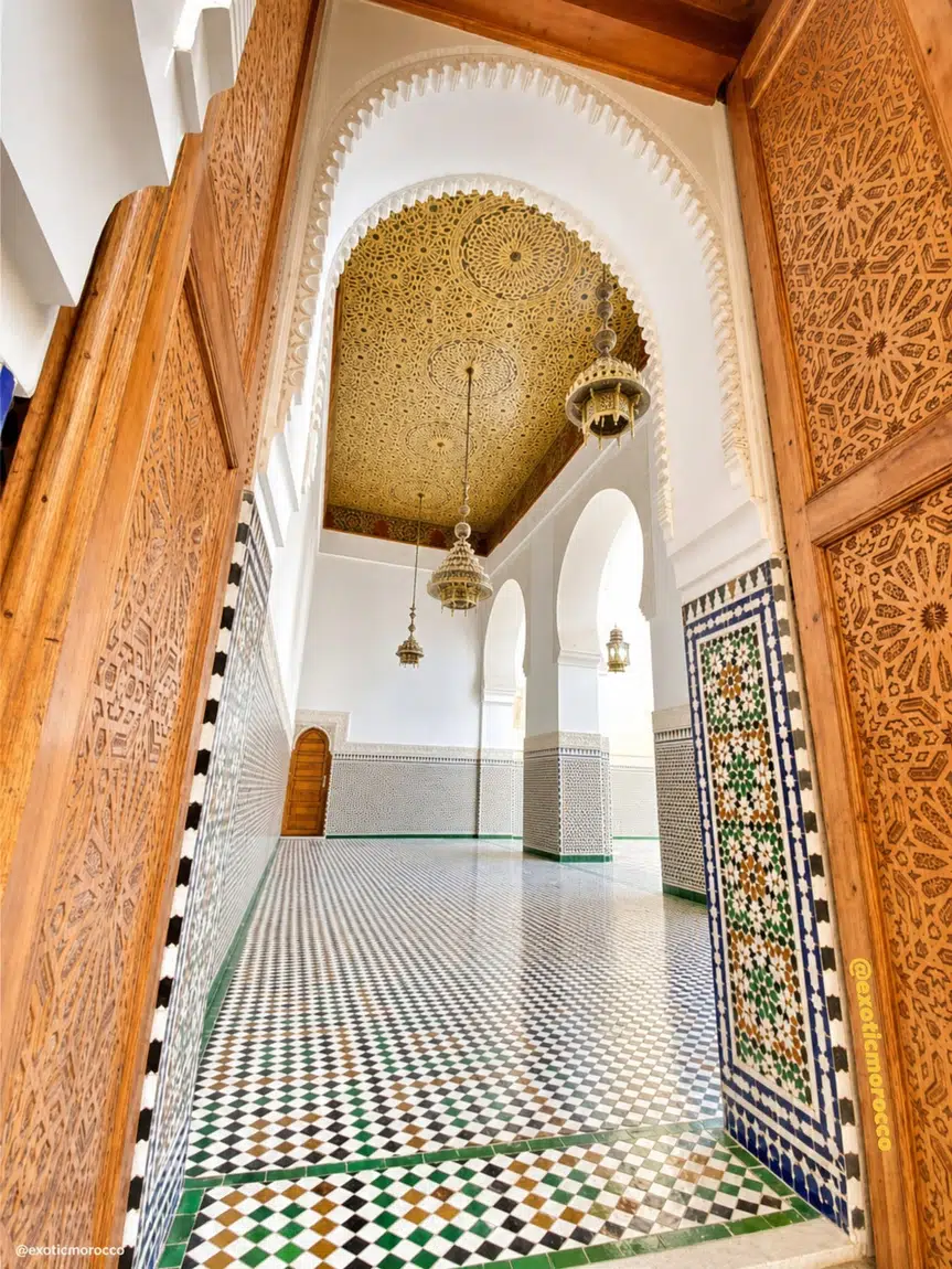 Moroccan zellige tilework and carved wood doorway interior