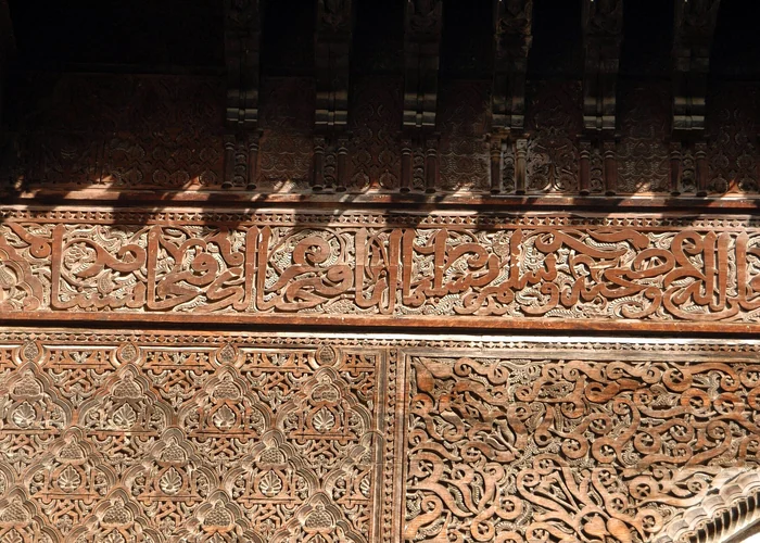 Close view of patterned carved architectural decoration