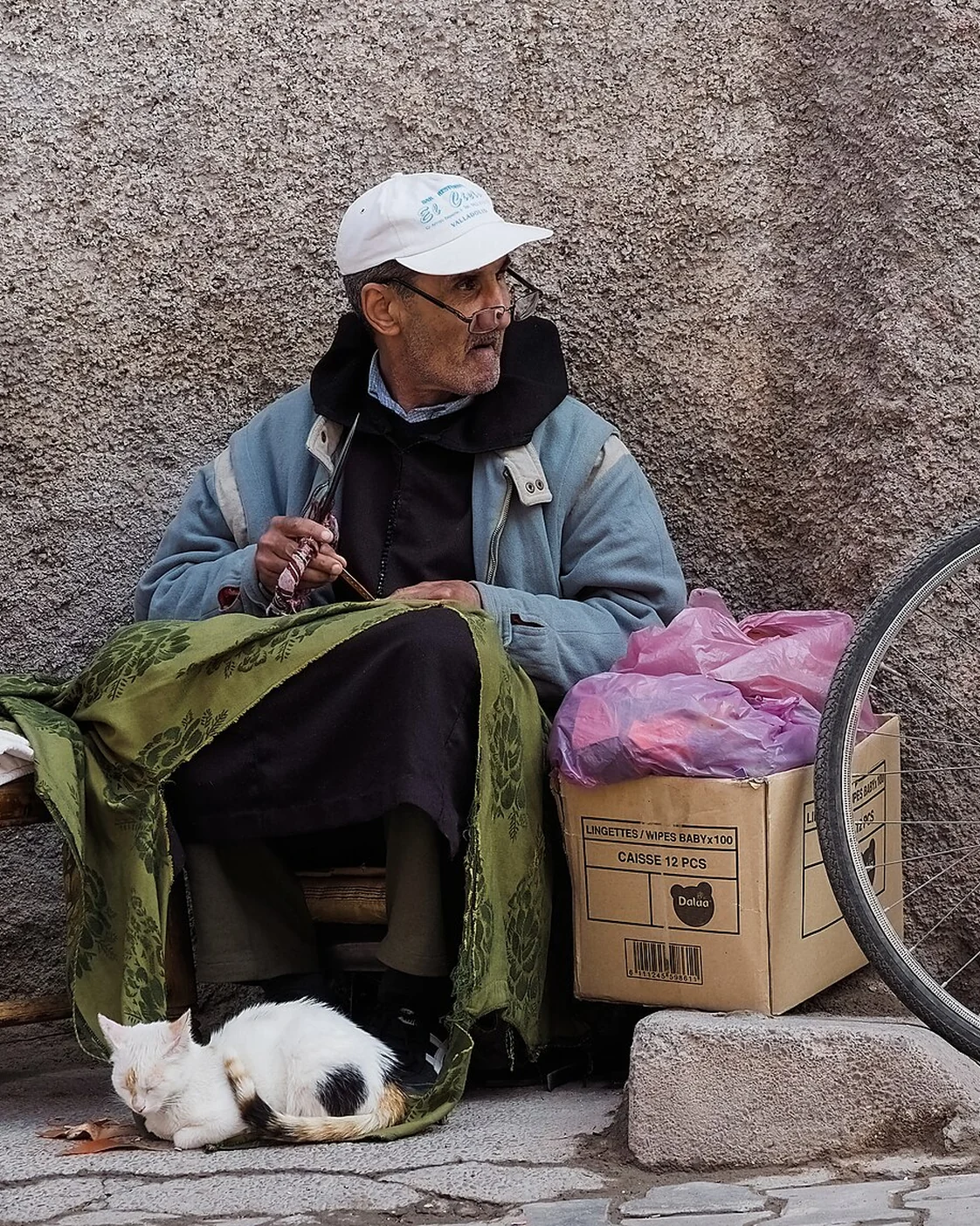 A leatherworker in Marrakech, photographed at work with prepared material.