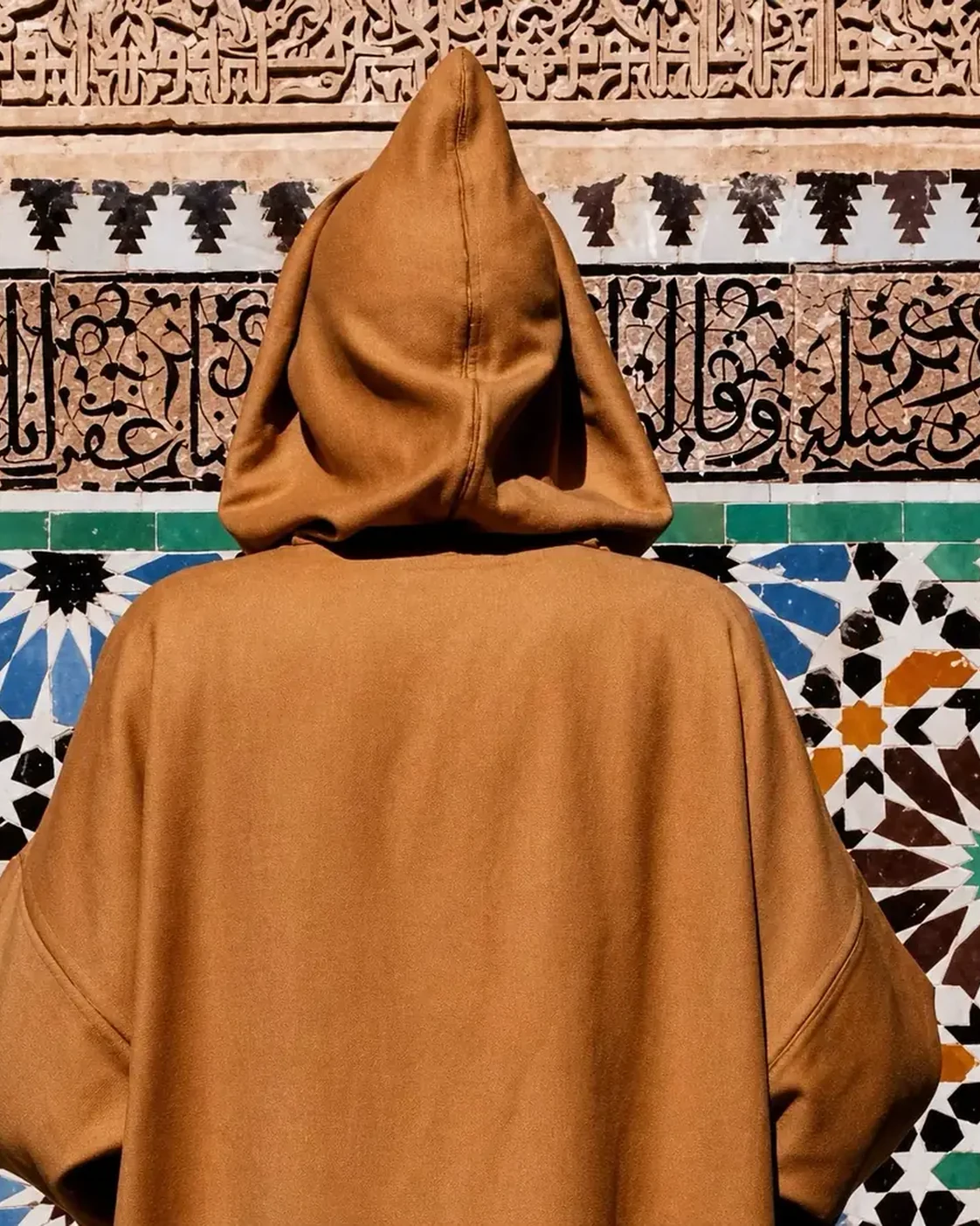 The hood and shoulder line of a djellaba.