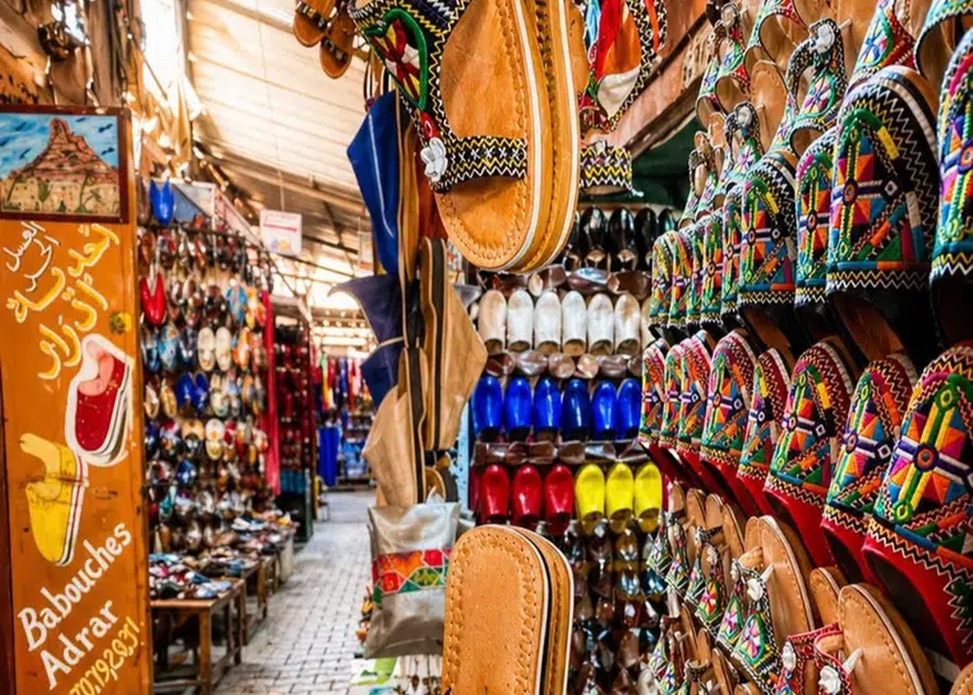Slippers and bags presented in a souk display.