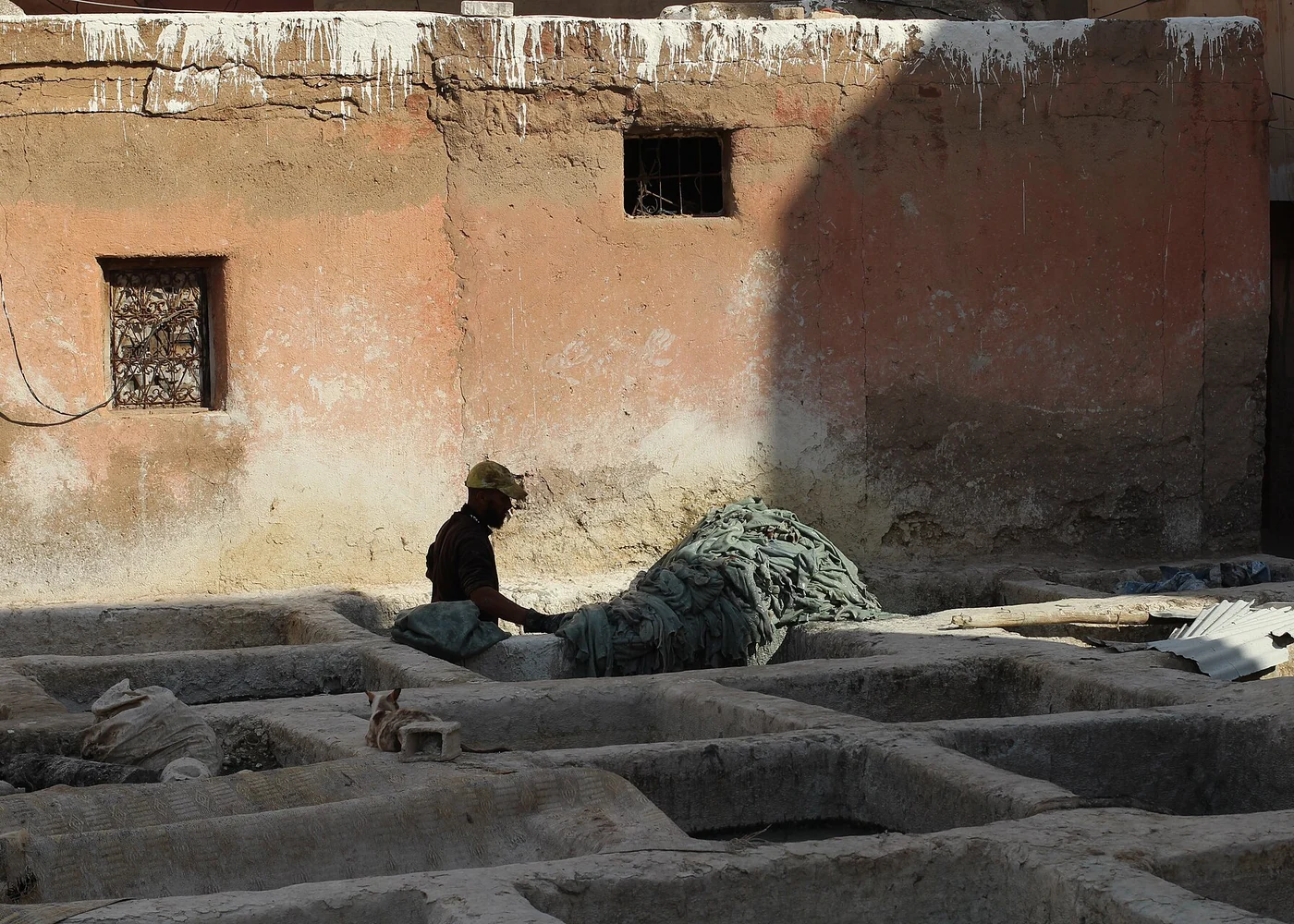 A worker photographed in a Moroccan tannery.