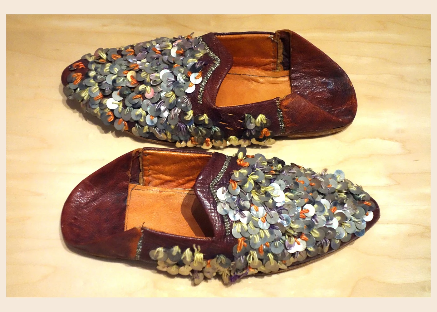 Twentieth-century Moroccan leather babouche with silver-coloured sequins, displayed at the Bata Shoe Museum in Toronto.
