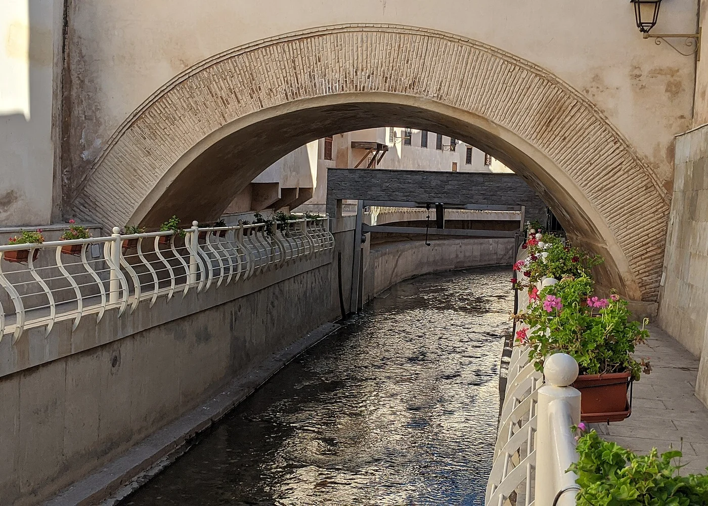 A canal and crossing photographed in Fez.