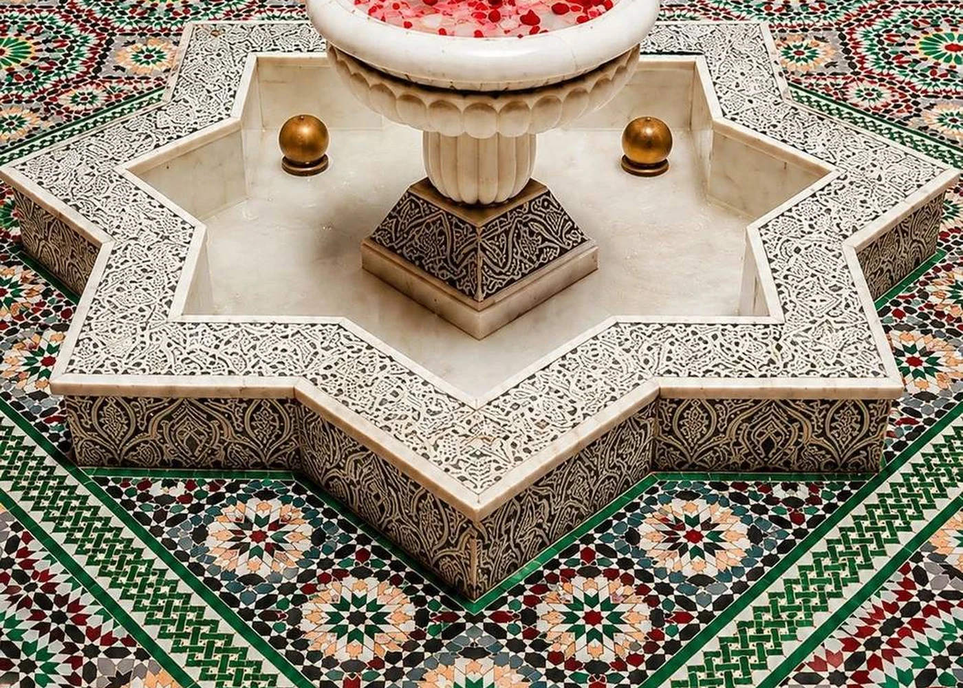 A fountain composition: water, geometry and cut ceramic.