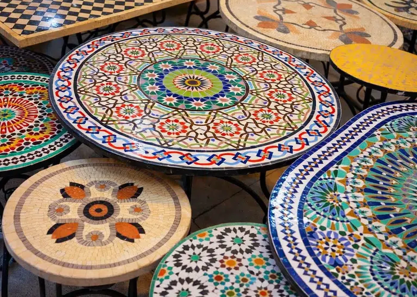 Mosaic tabletops show ornament at the scale of an object.