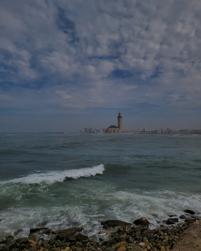 Hassan II Mosque seen across the Atlantic shore in Casablanca.