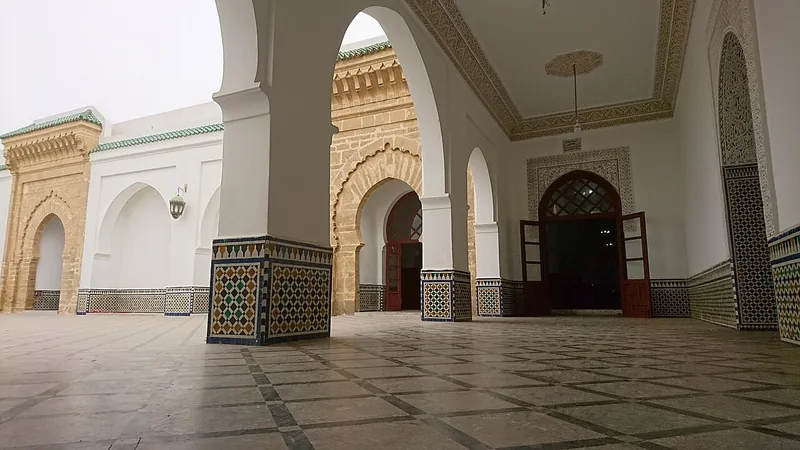 White arches and the prayer hall of the Great Mosque of Salé.