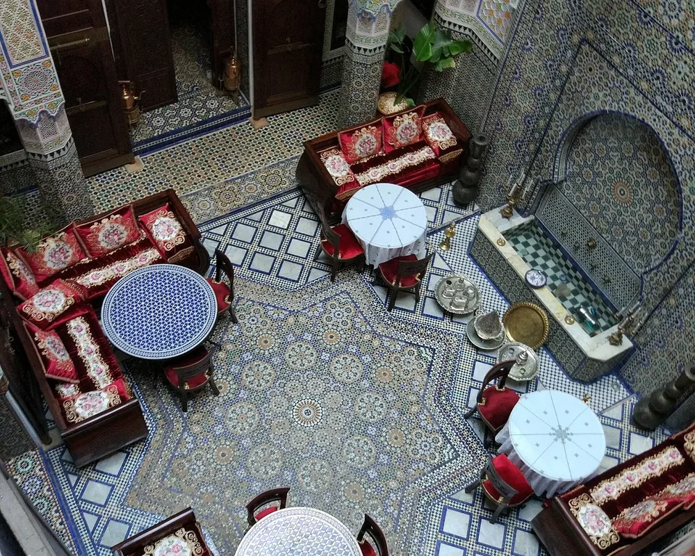 A courtyard in Fès viewed from above; a shared centre surrounded by rooms.