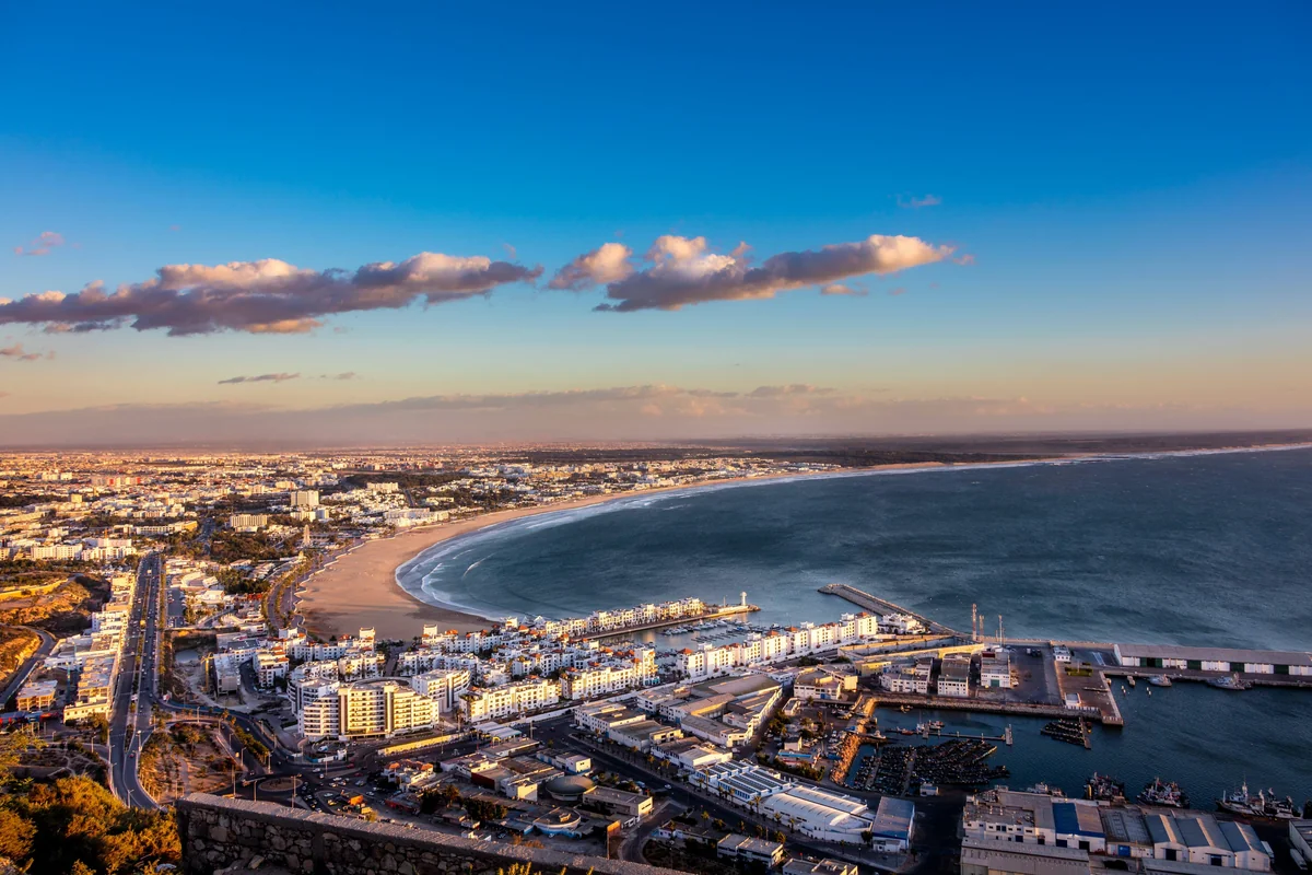 The curve of Agadir Bay and its waterfront buildings in evening light