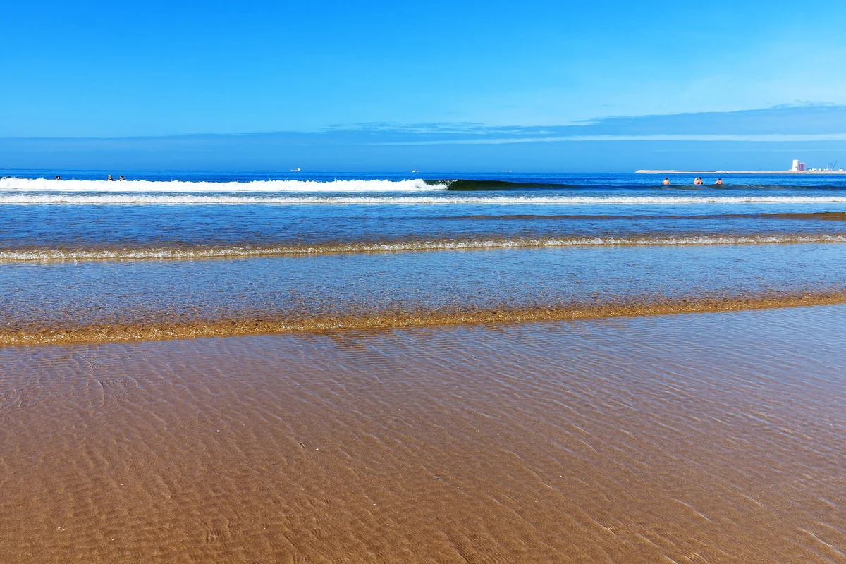 Waves breaking on the broad Atlantic beach at Agadir