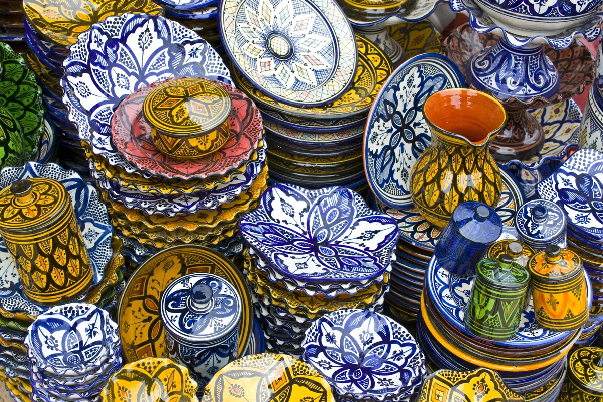 Colourful glazed bowls and plates displayed in Safi