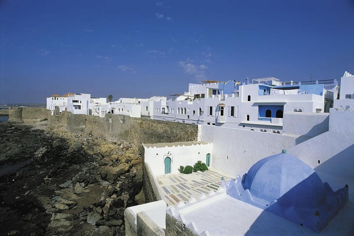 Whitewashed Asilah houses above the Atlantic sea walls