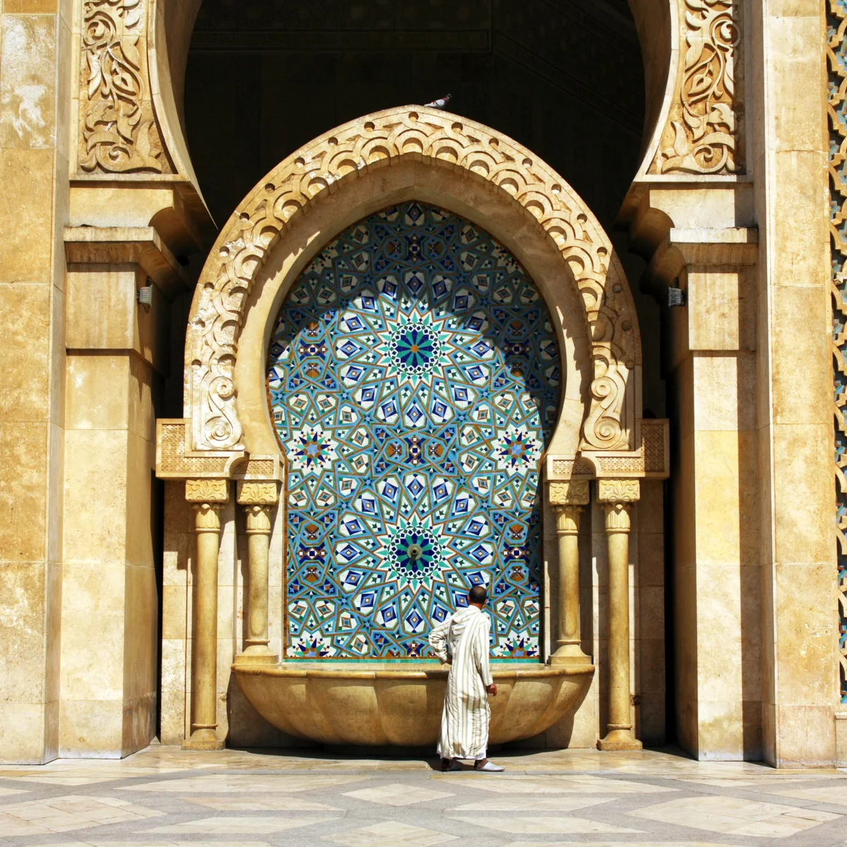 The entrance detail of Hassan II Mosque in Casablanca shows how scale and surface meet.