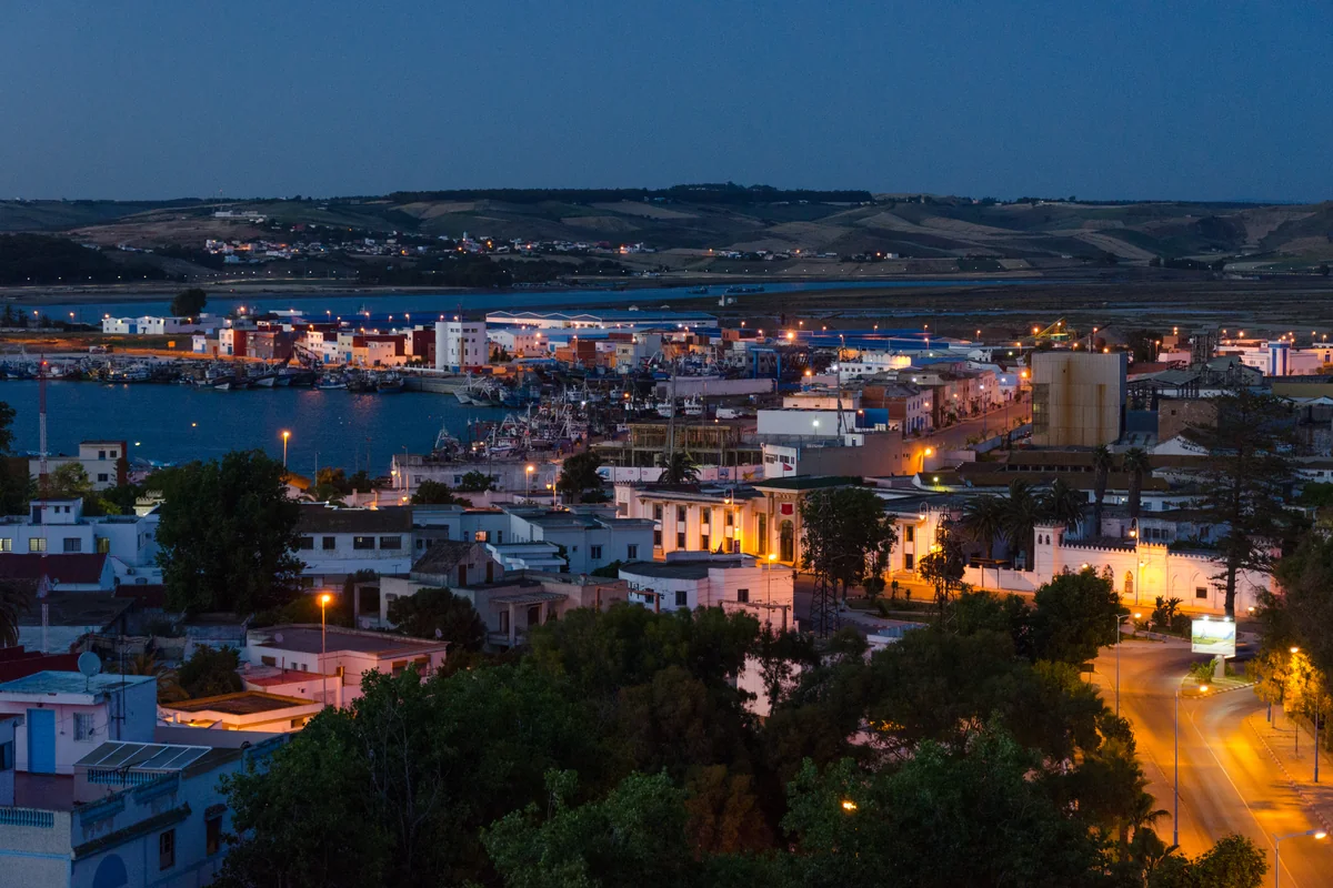 Lights appearing beside the river and port at Larache