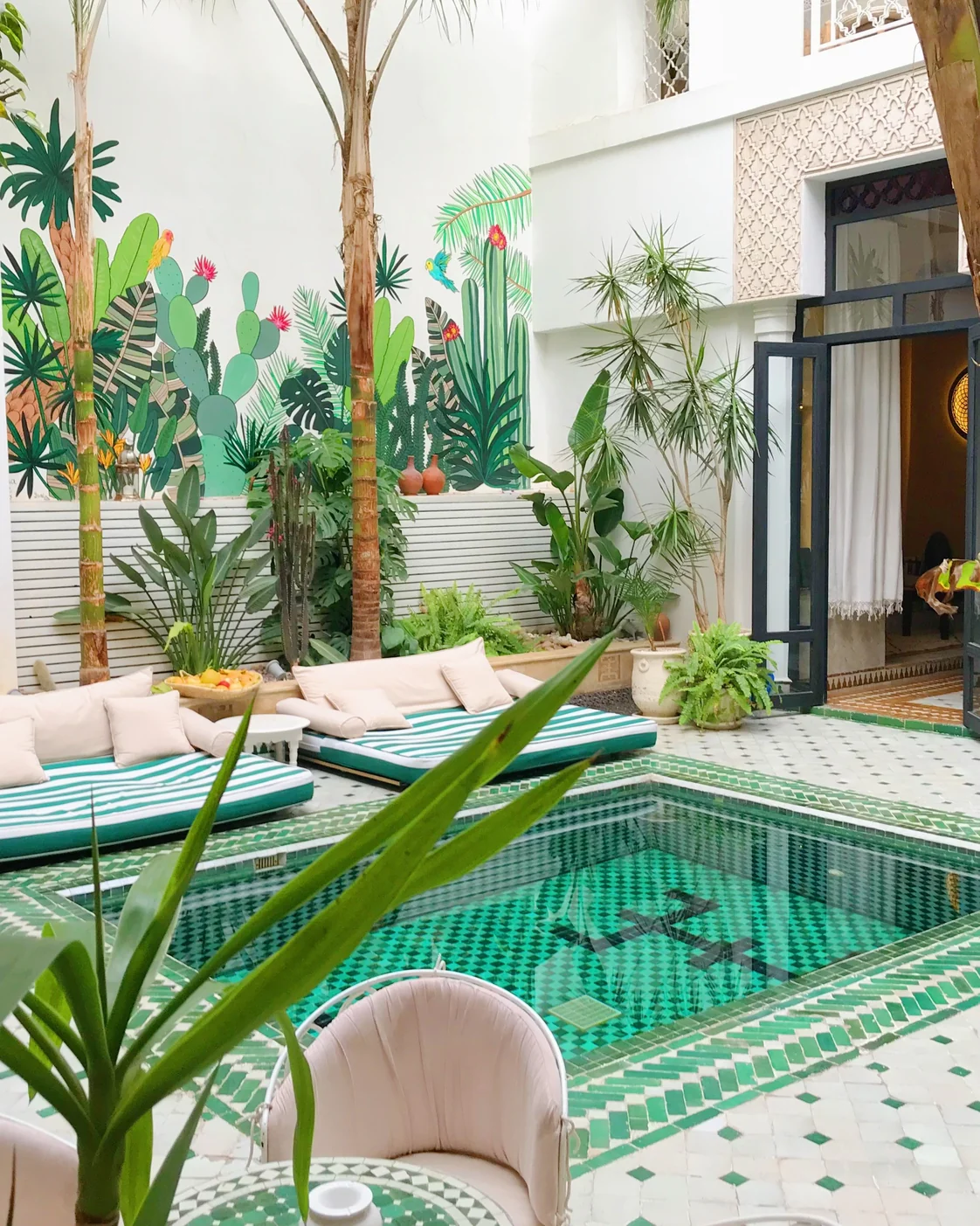 A planted riad courtyard: atmosphere is one part of a much wider accommodation choice.