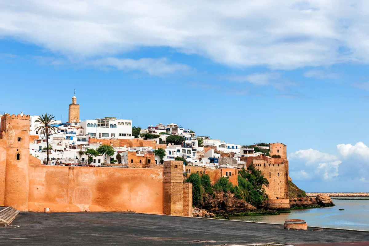 The ochre walls and white houses of Rabat's Udayas beside the water