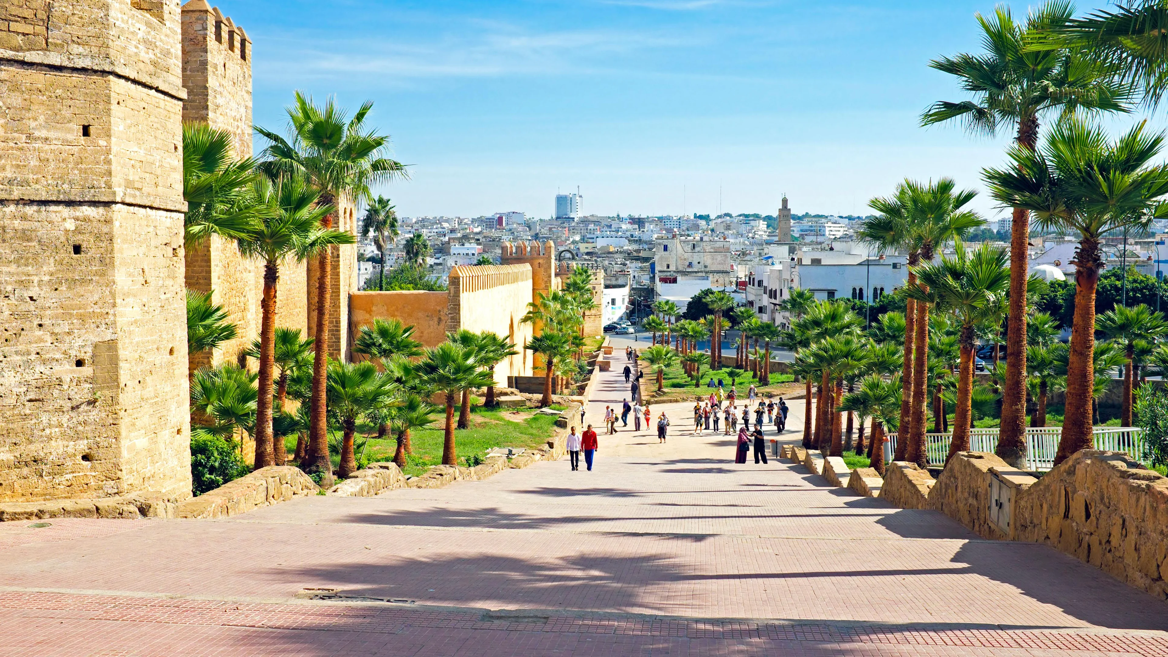 A broad pedestrian approach beside the historic walls of Rabat