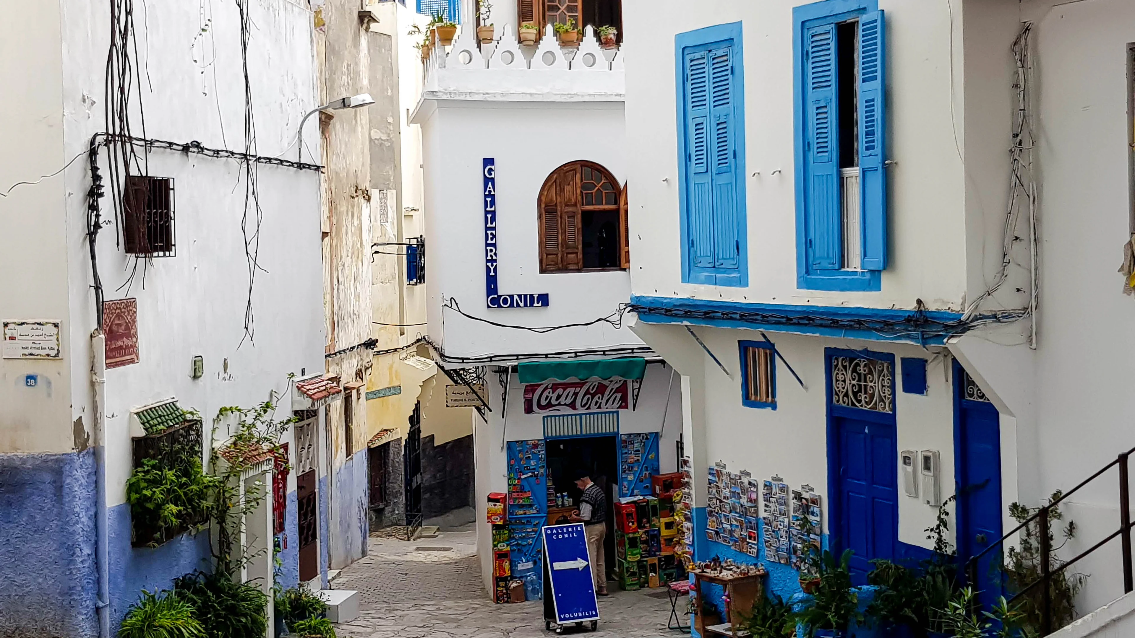 Blue doors and whitewashed buildings on a lane in Tangier