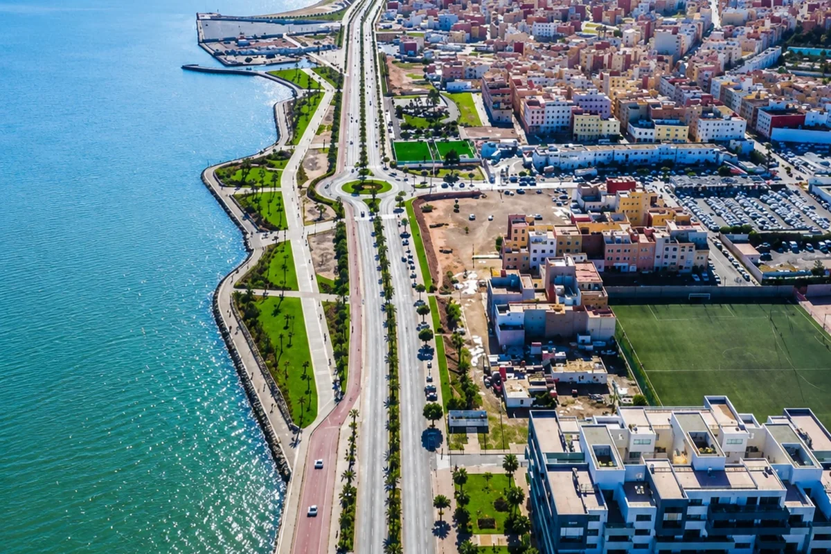 Aerial view of Nador corniche, coastal road, lagoon edge and urban neighborhoods
