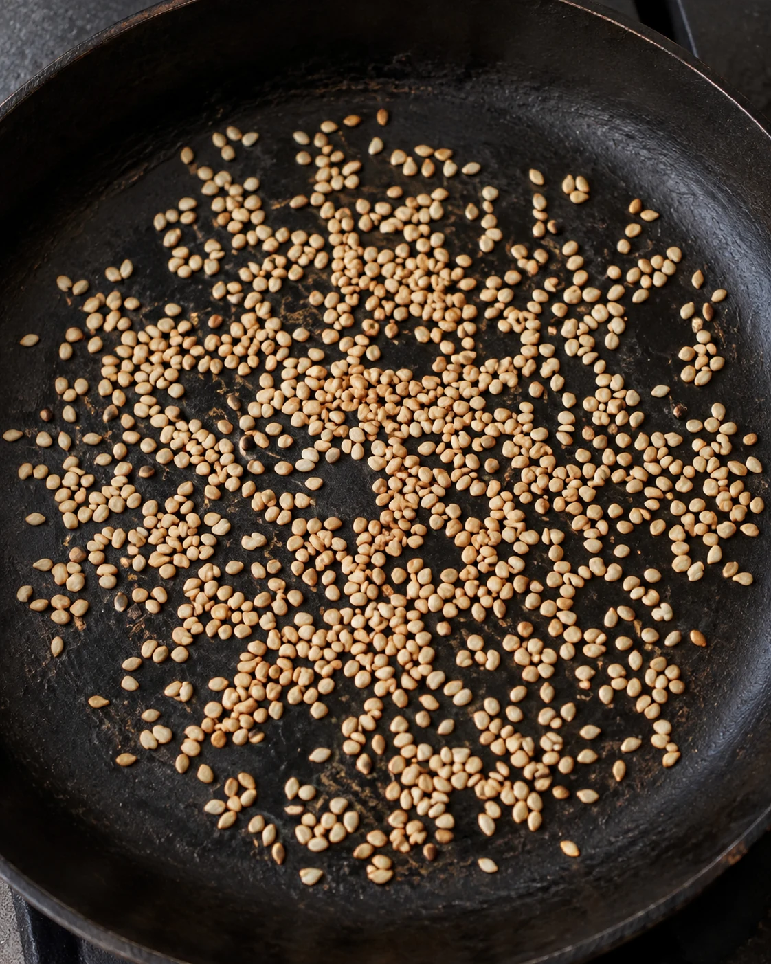 Sesame seeds lightly toasted in a pan
