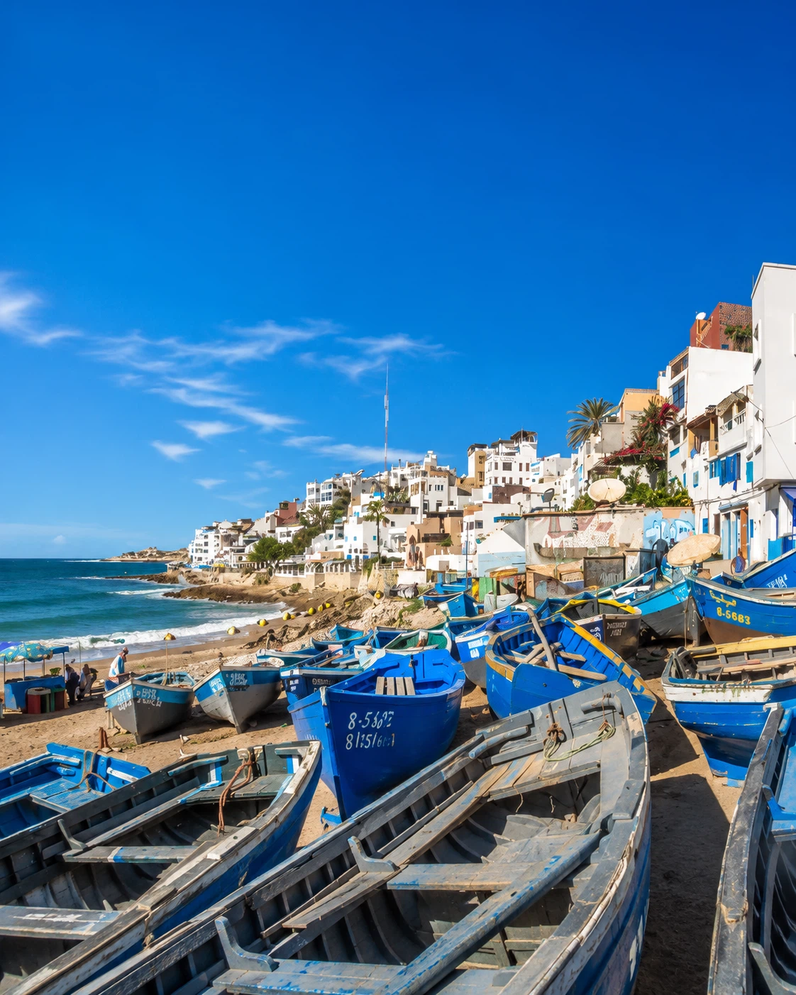 Taghazout fishing boats and white coastal village north of Agadir
