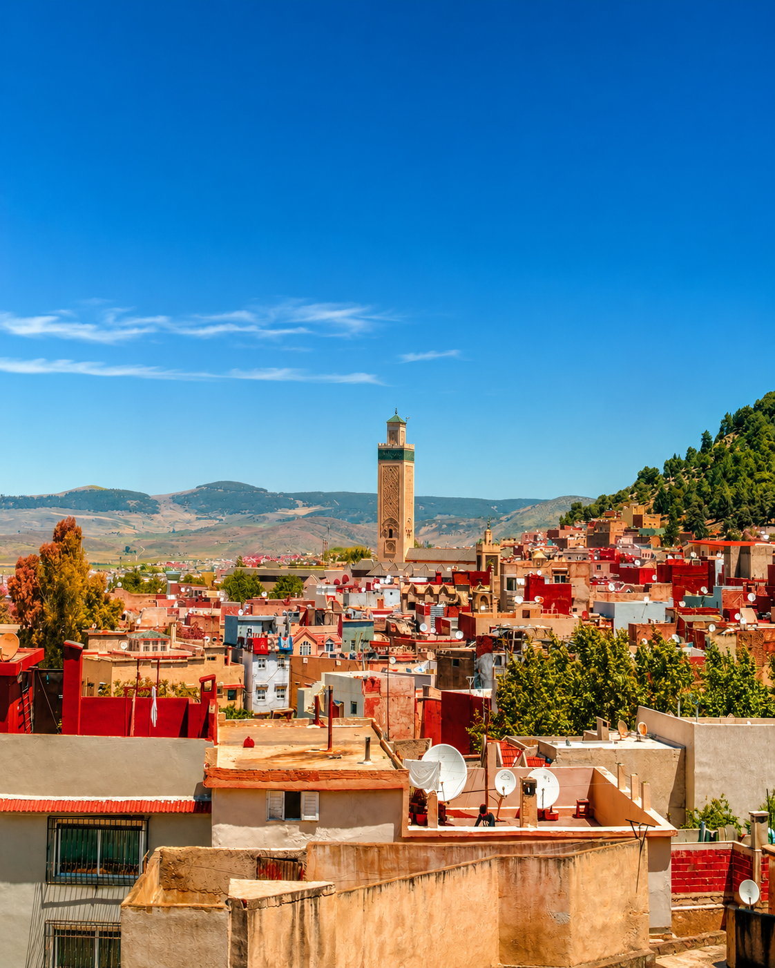 Azrou town roofs and minaret under clear highland light