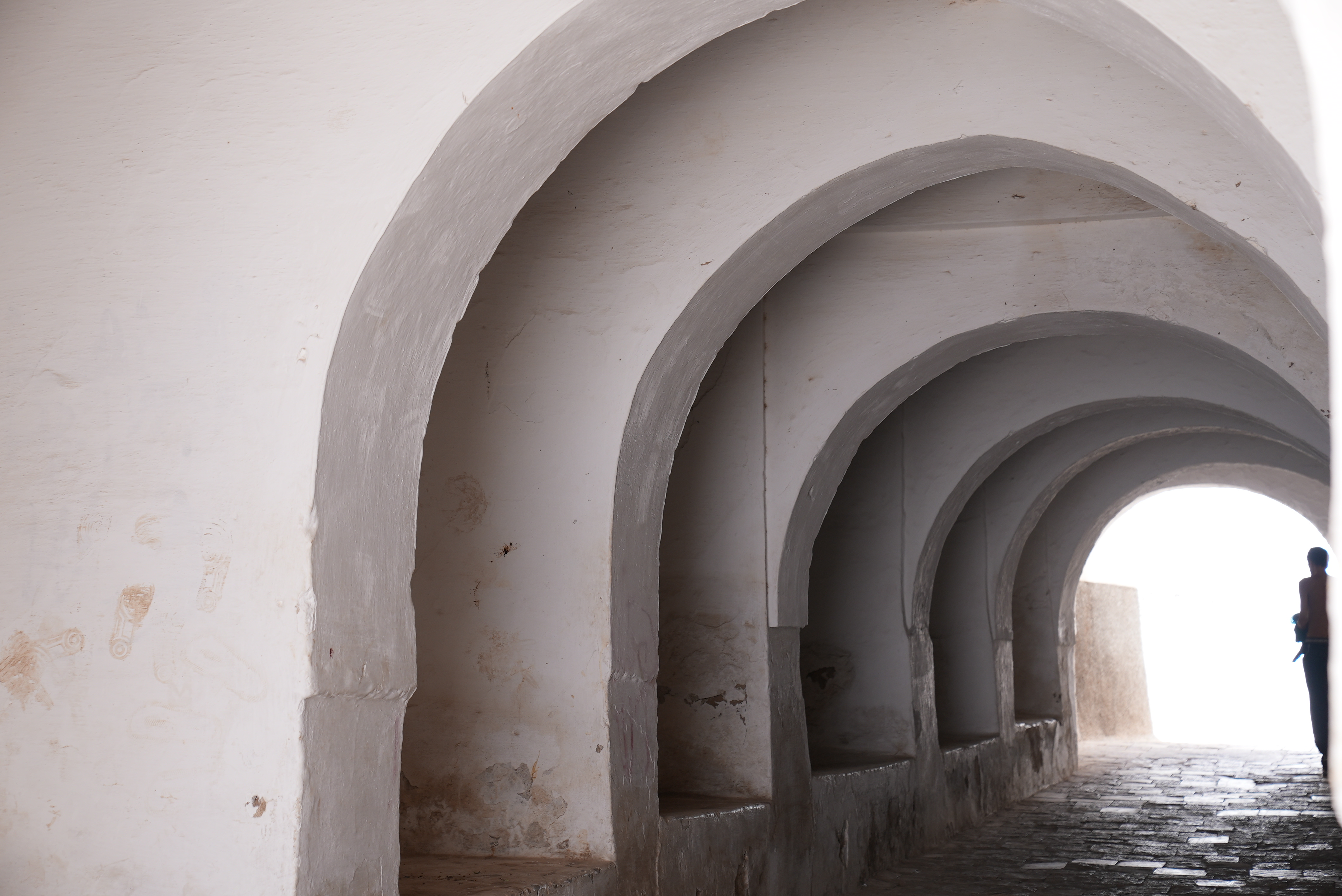 Vaulted white passage opening onto daylight in Derb Arbaoua, Bejaad