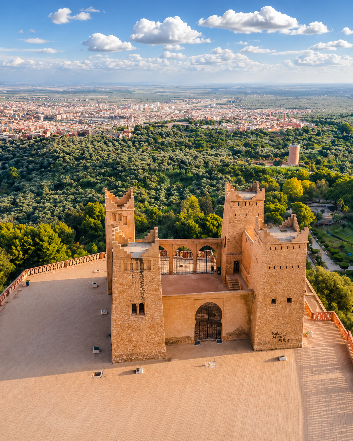 Aerial view of the Beni Mellal kasbah, green foothills and city beyond