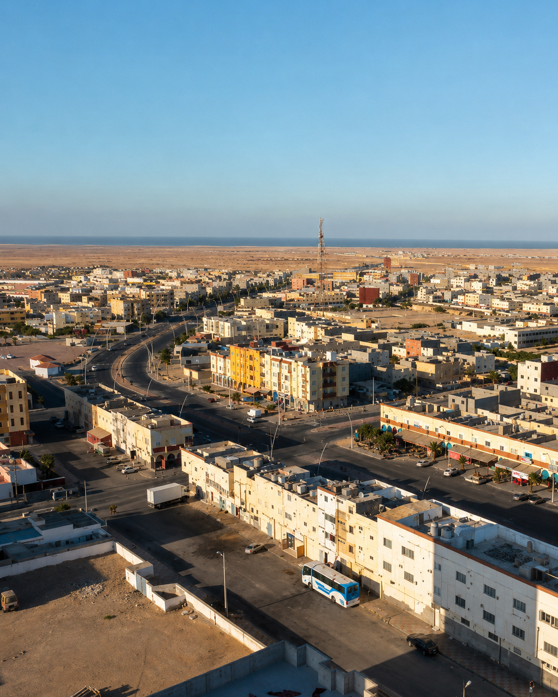 Boujdour streets and low-rise buildings with the lighthouse and Atlantic horizon