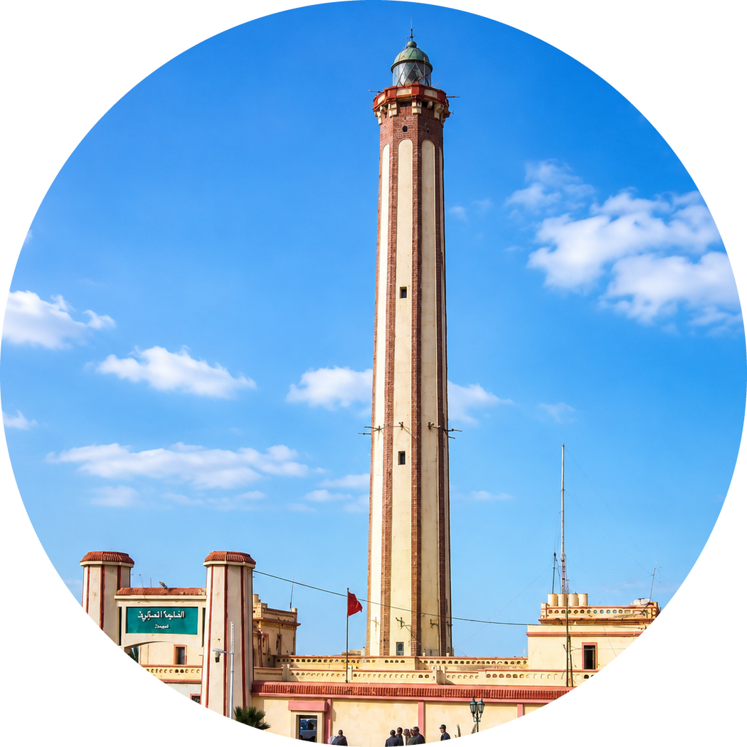 Boujdour lighthouse with its tall striped tower and entrance buildings