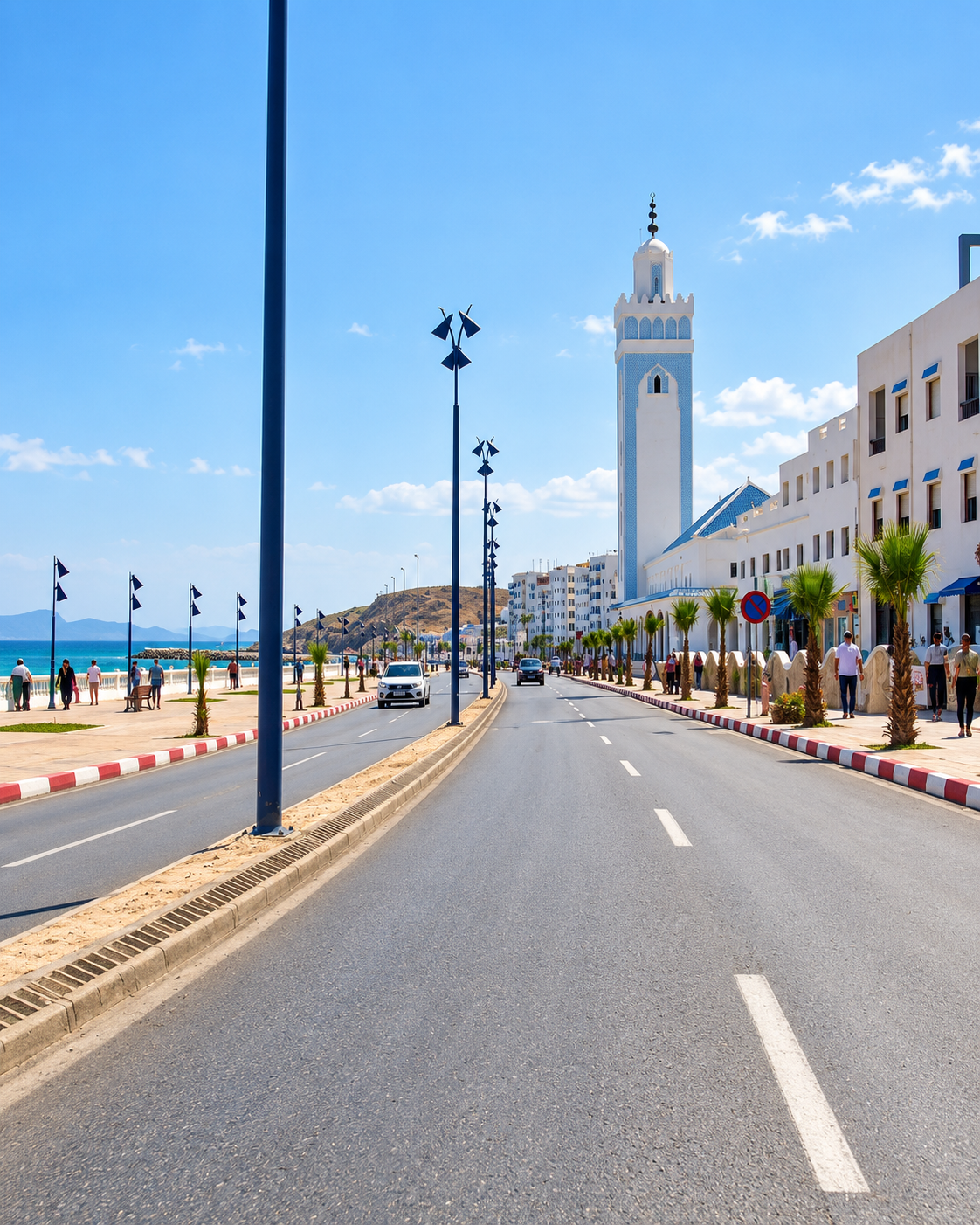 Waterfront road with blue street lamps and the Fnideq seafront mosque