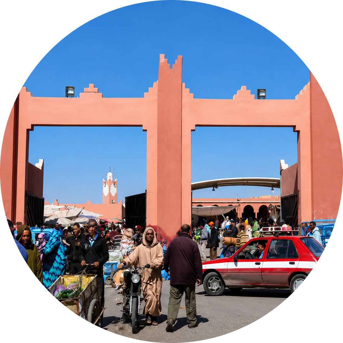 Salmon-coloured market gateway with shoppers, stalls and a red taxi