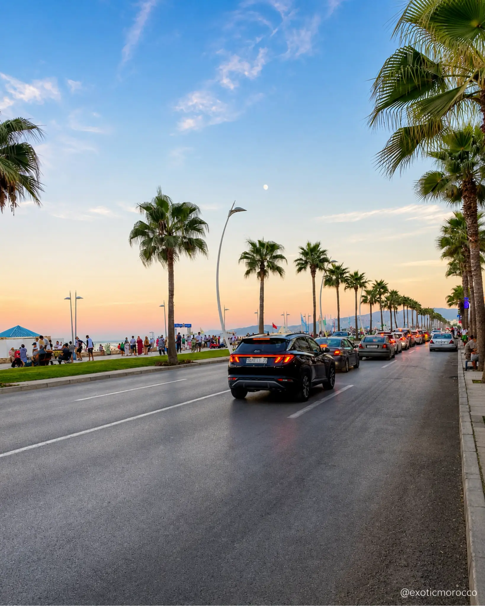 Palm-lined Martil corniche near the Mediterranean at soft evening light