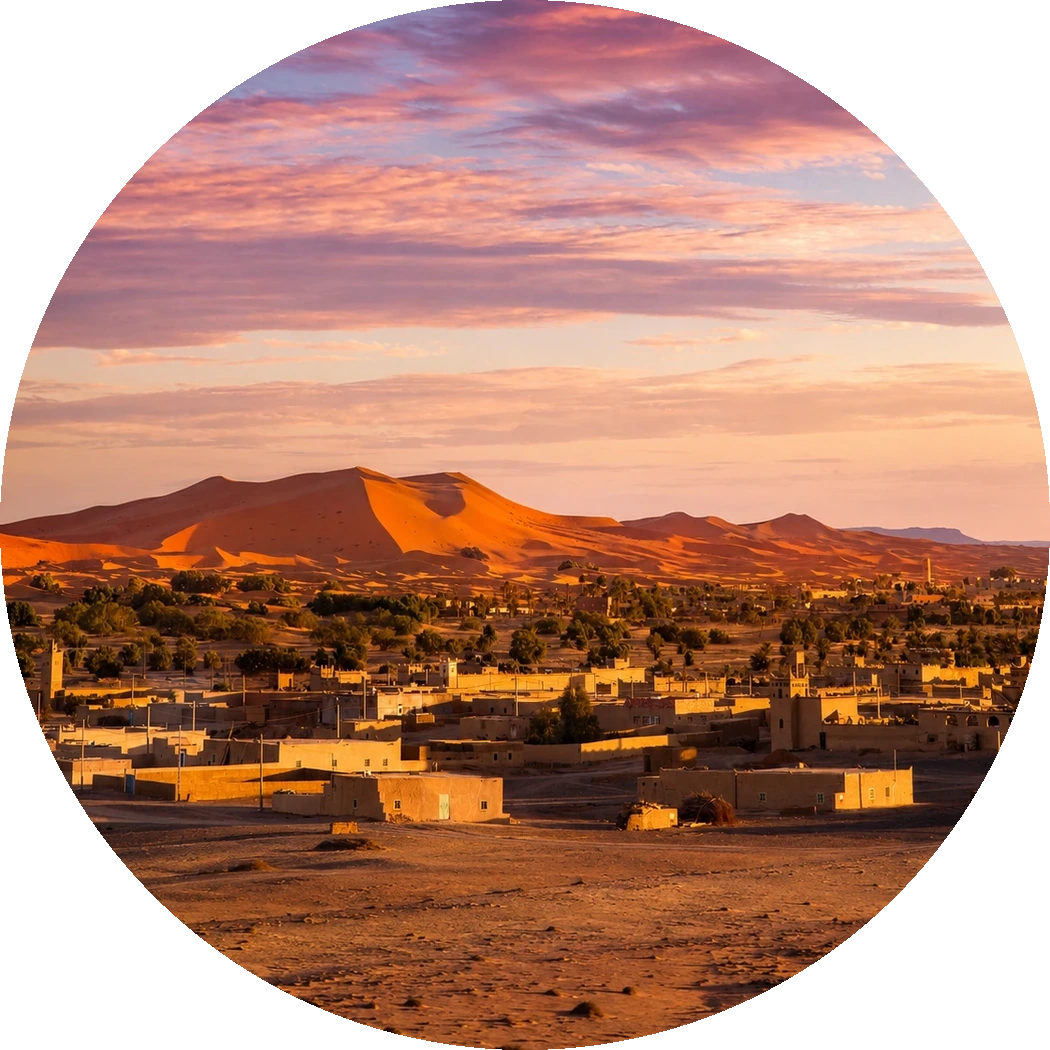 Merzouga settlement with Erg Chebbi rising behind it