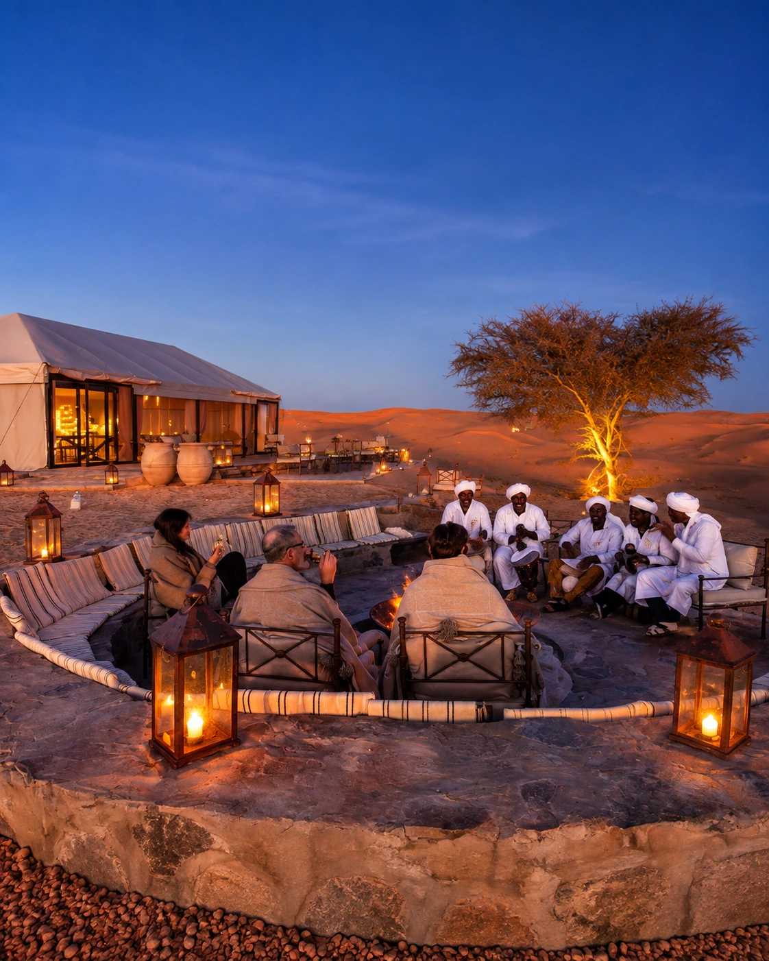 Evening desert camp gathering with music near Merzouga
